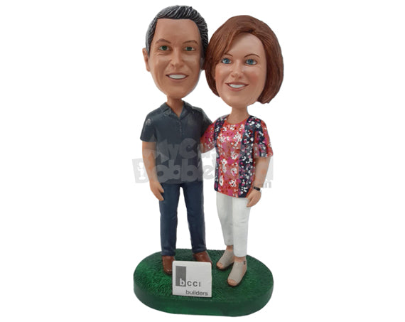 Custom Bobblehead Builder Couple Standing Next To Their Board While Putting Hands On Each Other Shoulders - Wedding & Couples Couple Personalized Bobblehead & Cake Topper Custom Bobblehead Builder Couple Standing Next To Their Board While Putting Hands On Each Other Shoulders - Wedding & Couples Couple Personalized Bobblehead & Cake Topper